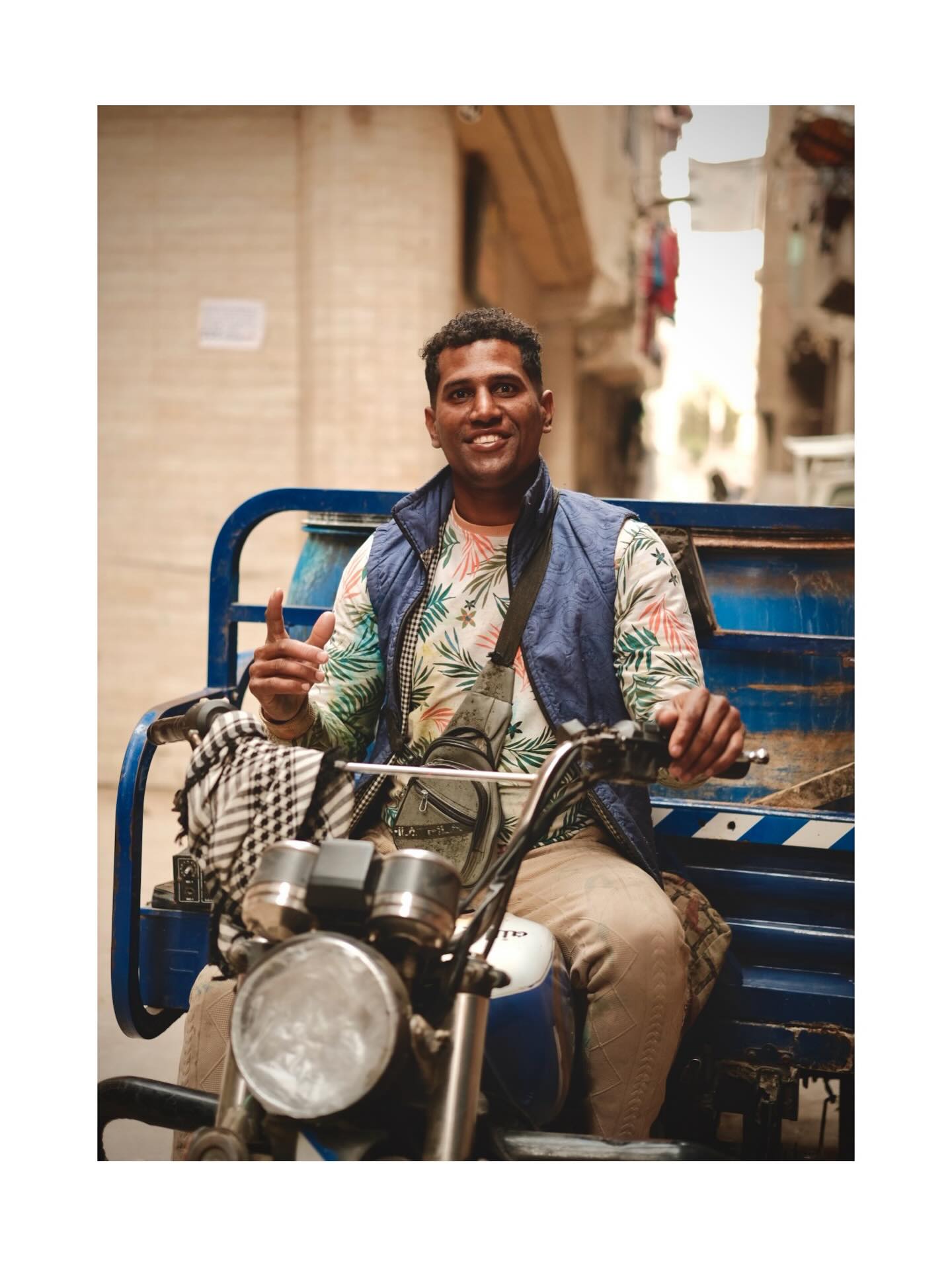 Smiling motorcycle rider giving a thumbs-up