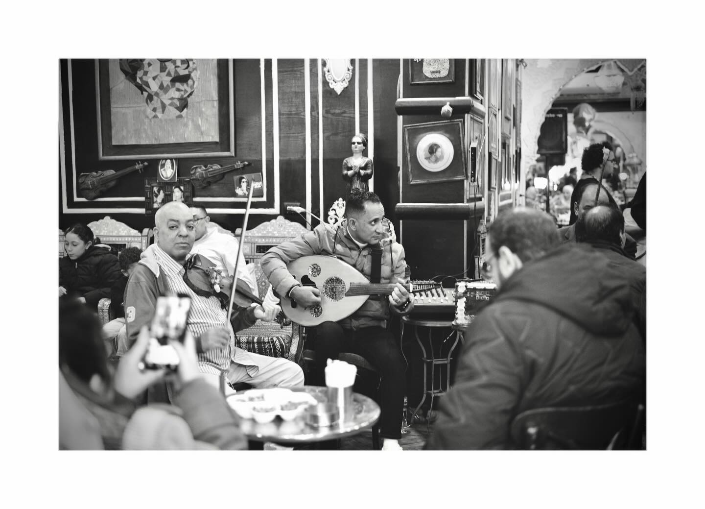 Musicians and listeners around a table