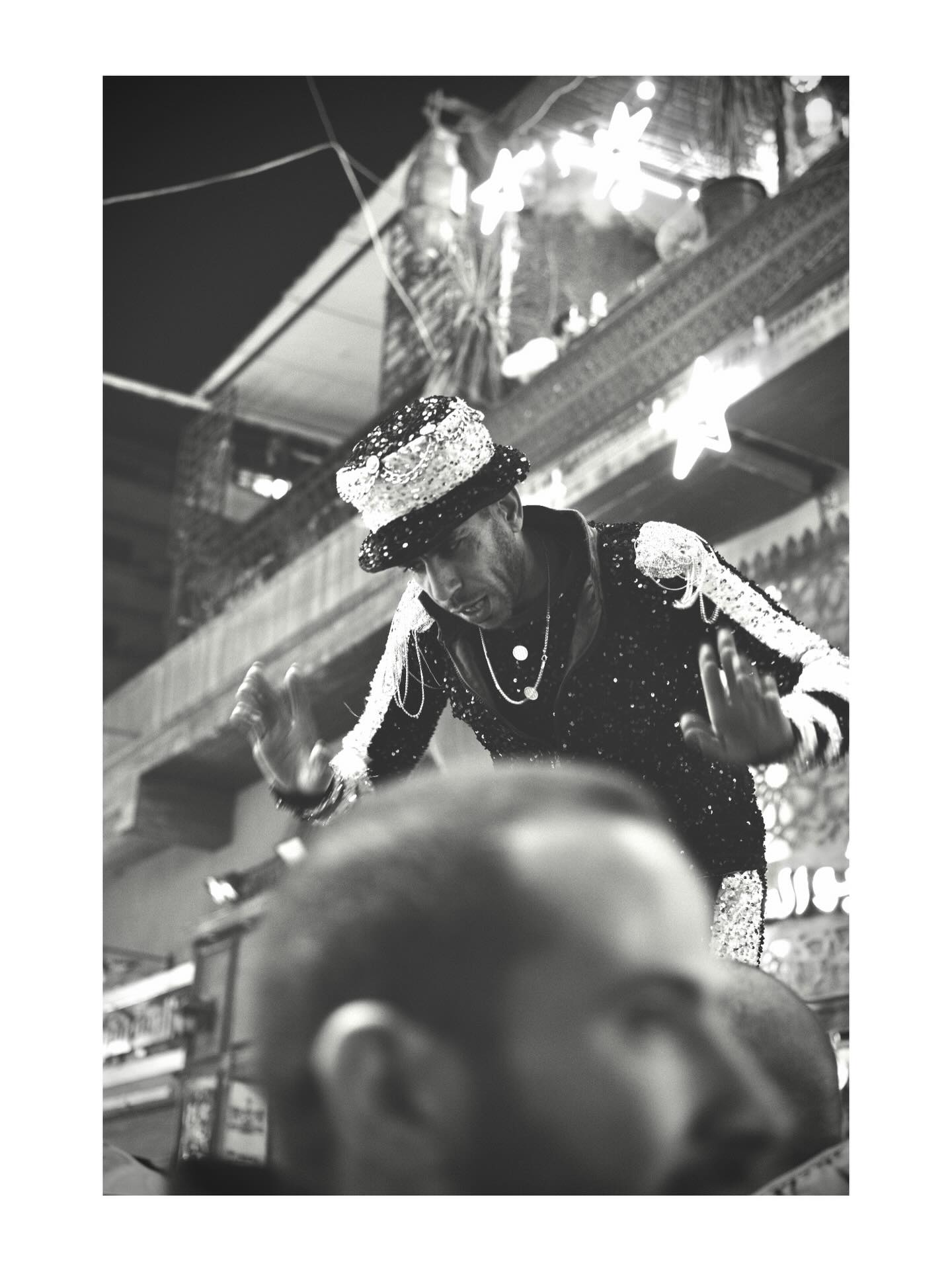 Performer beneath bright lights