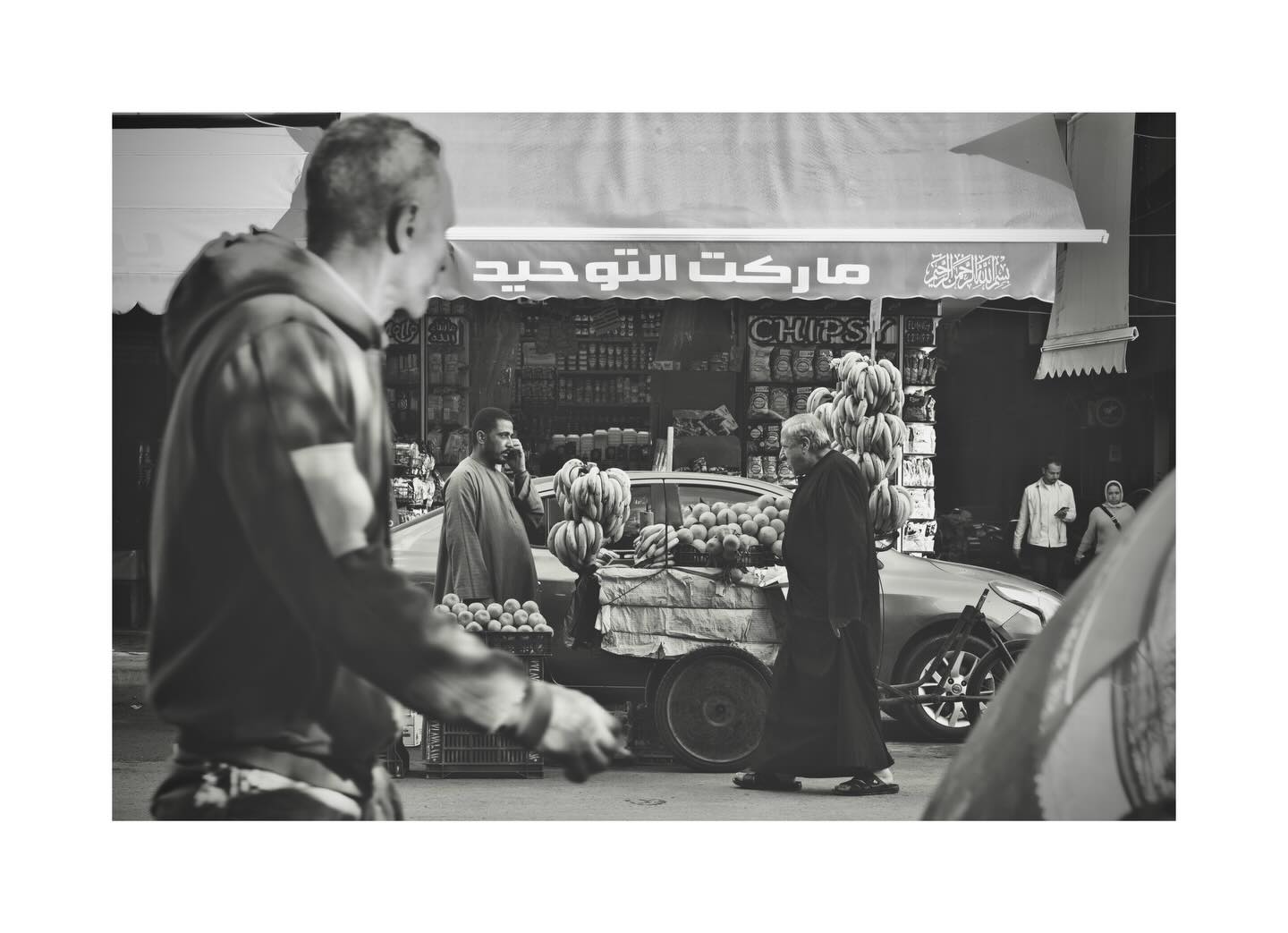 Man passing a street market