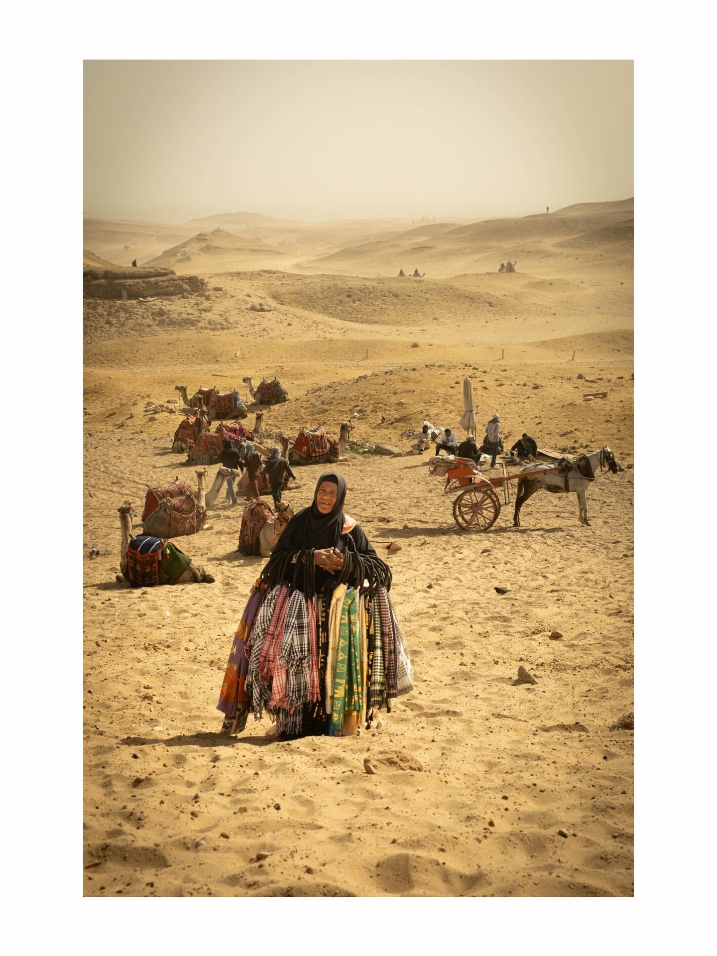 Vendor with colorful goods near the pyramids