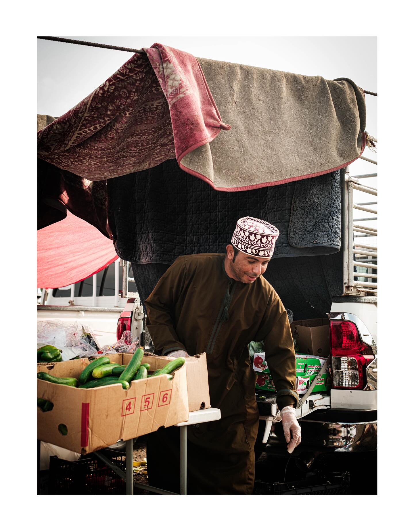 Produce seller at his market stall