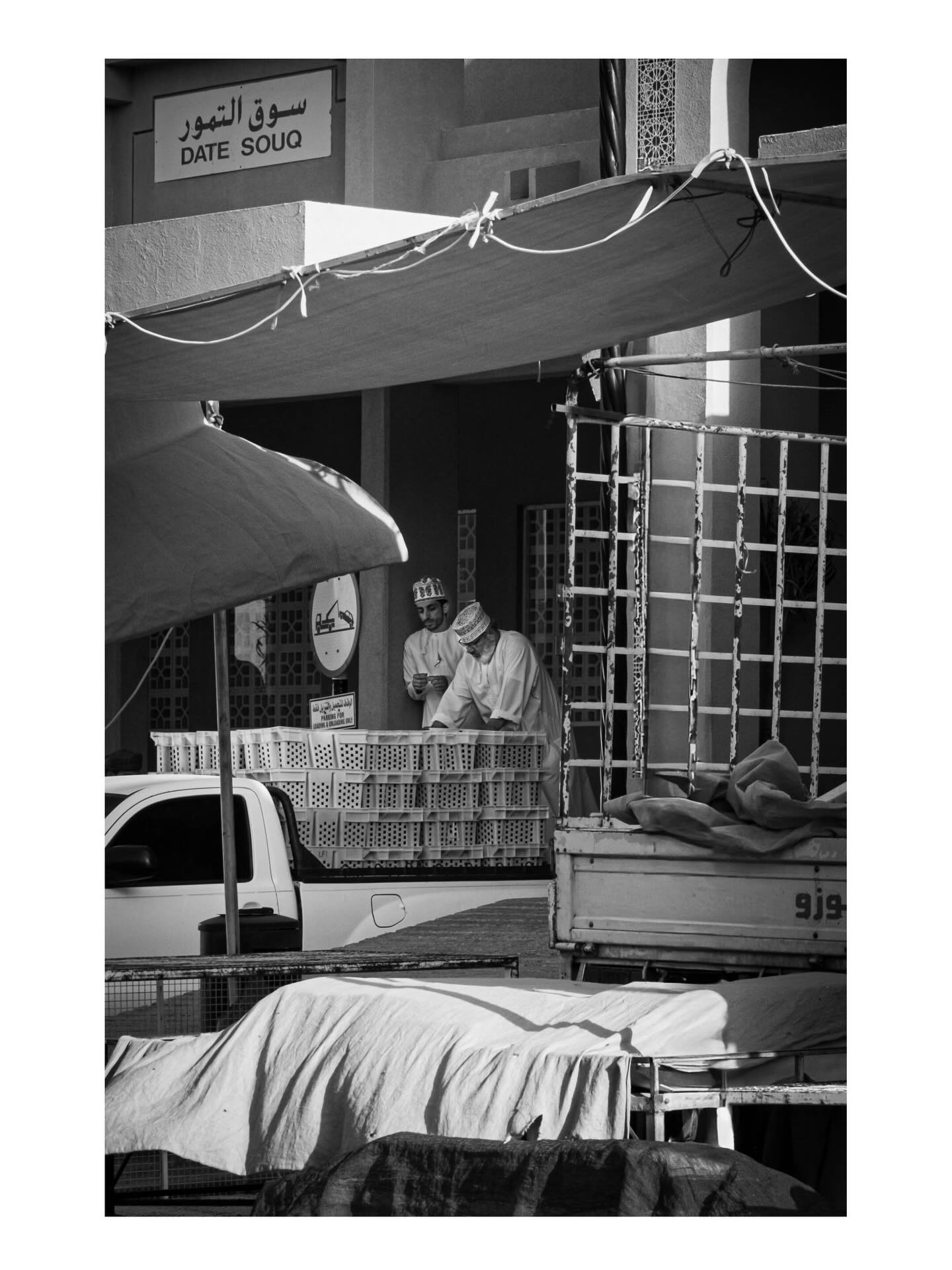 People and stalls outside a souq