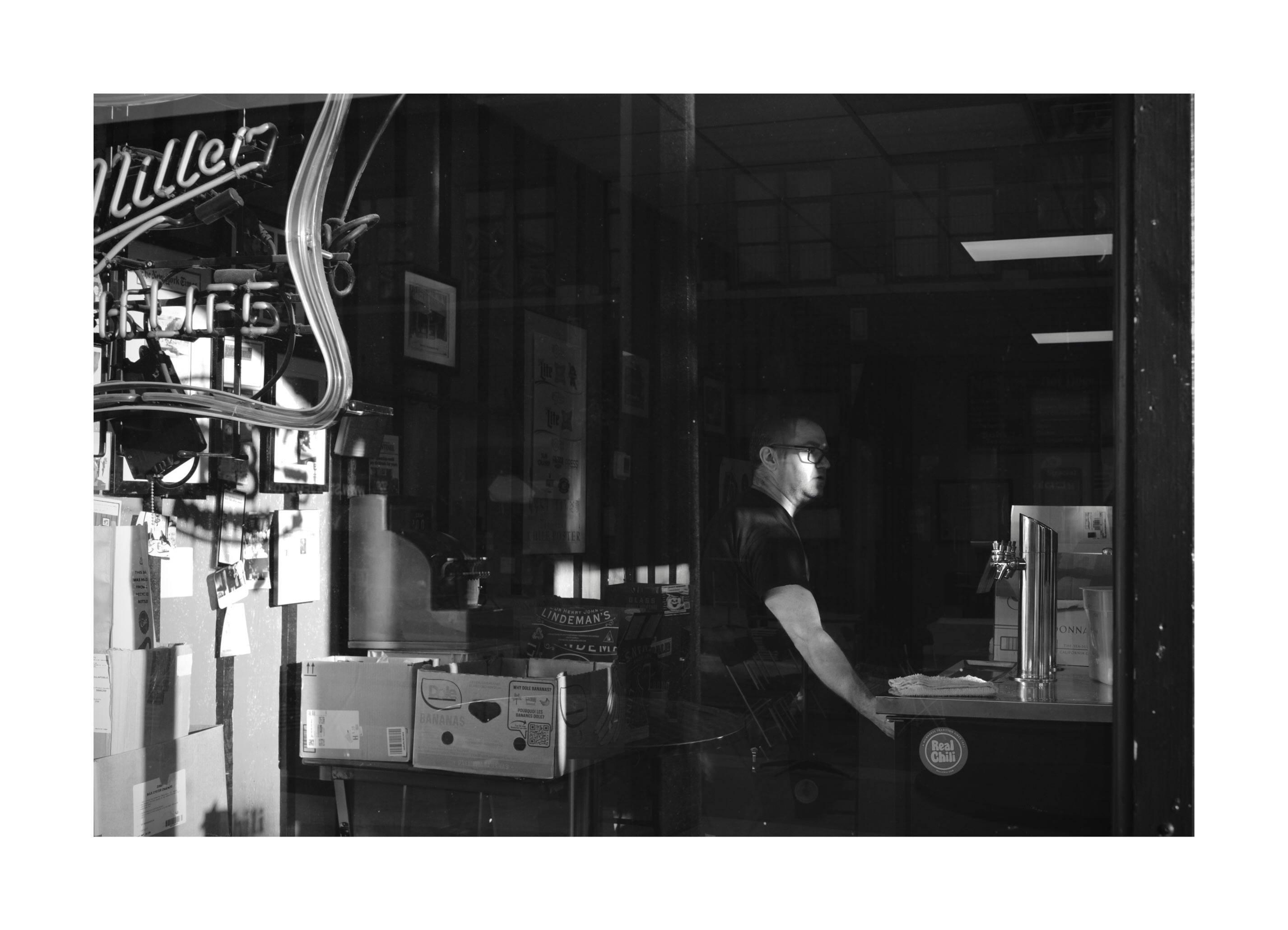 Man working behind a bar