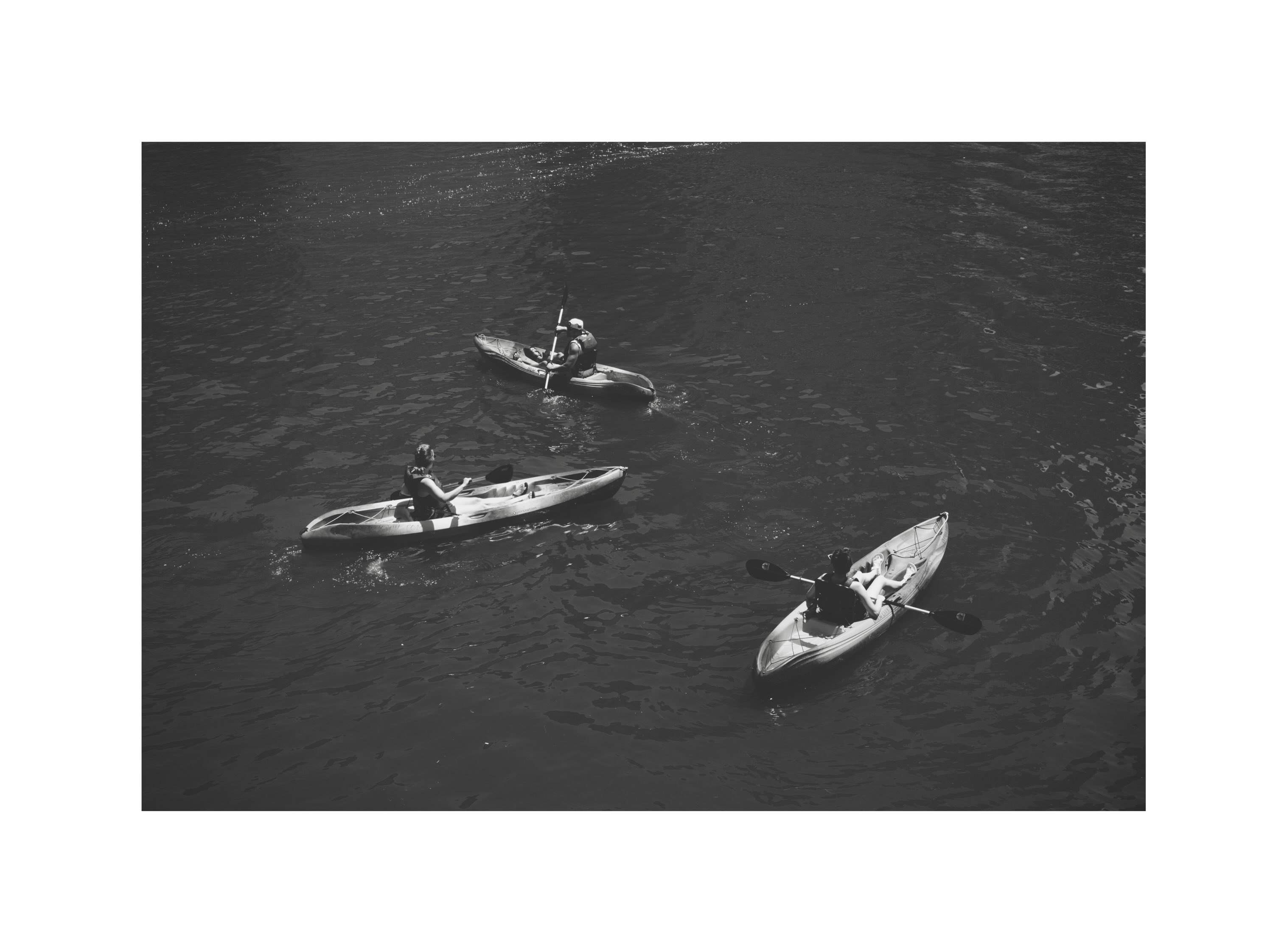 Kayakers on the river viewed from above
