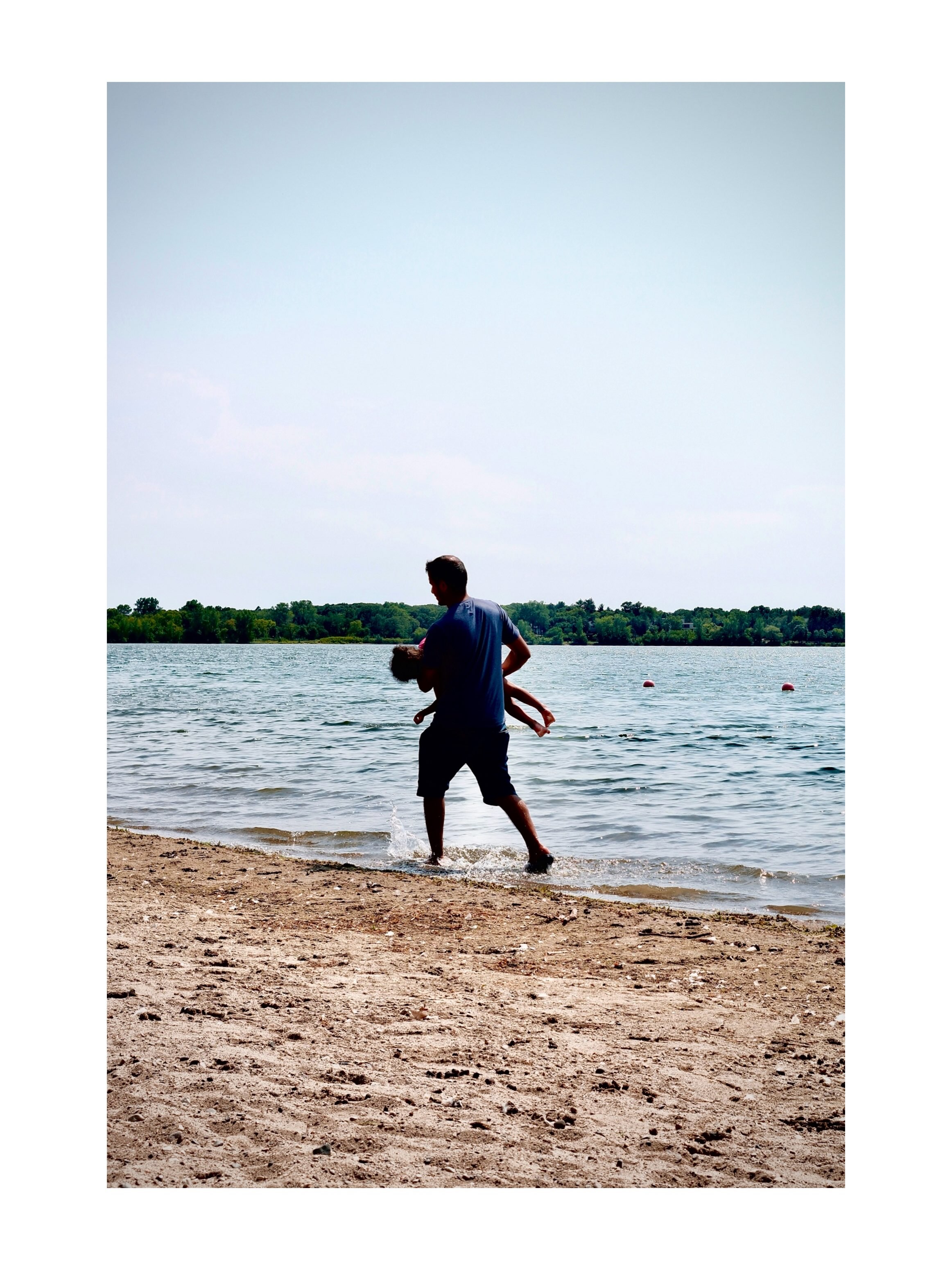 Child walking along a beach