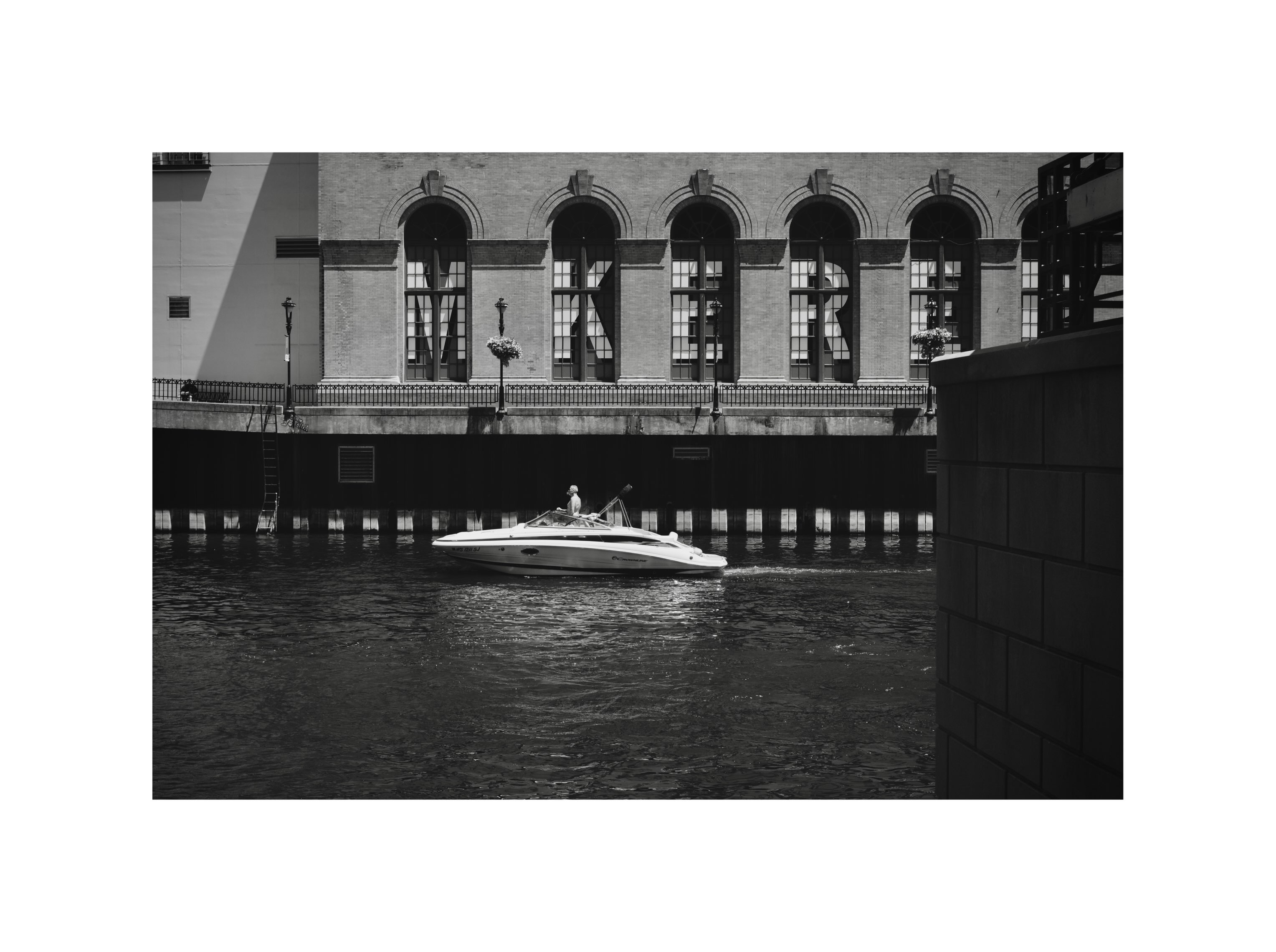 Boat beneath a bridge